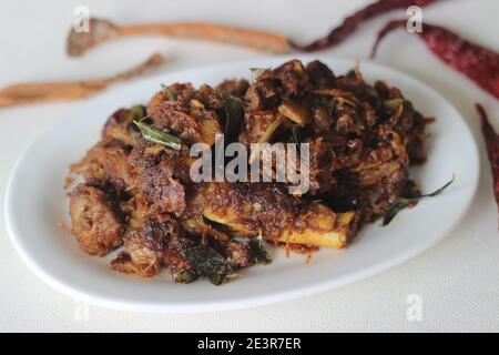 Spicy mutton roast prepared in Kerala style for special occasions like Christmas, Easter, Onam and other festivals Stock Photo