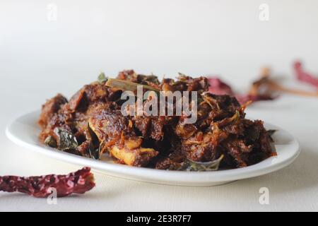 Spicy mutton roast prepared in Kerala style for special occasions like Christmas, Easter, Onam and other festivals Stock Photo