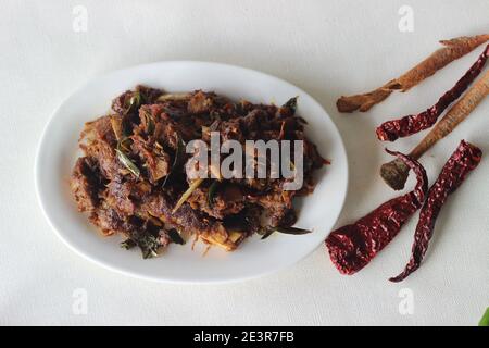 Spicy mutton roast prepared in Kerala style for special occasions like Christmas, Easter, Onam and other festivals Stock Photo