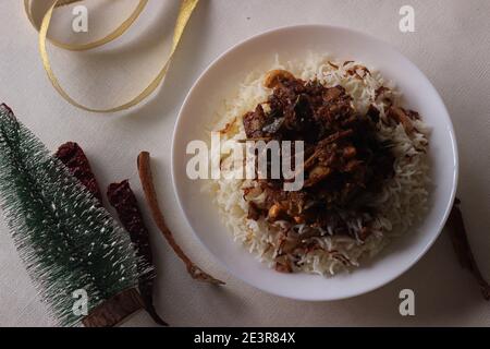 Mutton ghee roast. Goat meat fry with potatoes, also known as Mutton ...