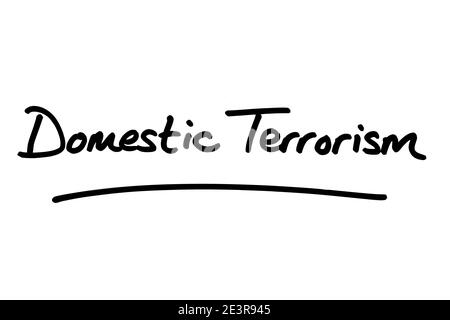 Domestic Terrorism, handwritten on a white background. Stock Photo