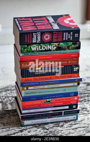 Book stack on white wooden floor Stock Photo