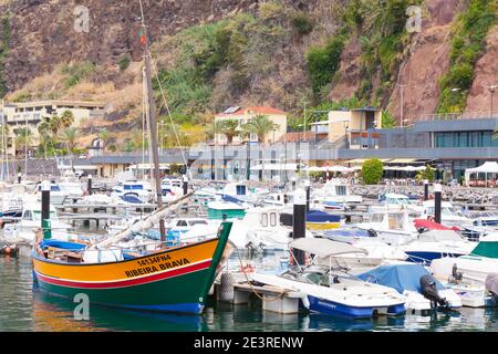 Calheta of Madeira, Portugal - August 23, 2017: Sailing yachts and boats moored in marina of Calheta Stock Photo