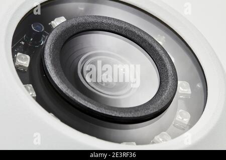 Dome secure camera on light background with motion sensors. Video surveillance camera. Closeup, selective focus. Stock Photo