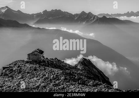 Italy, Alto Adige. Dramatic mountain images in monochrome of Schwarzenstein Hut mountain refuge owned by the Italian Alpine Club CAI in the mountains of the Sud Tyrol on the Italian side of the Zillertal Alps Stock Photo
