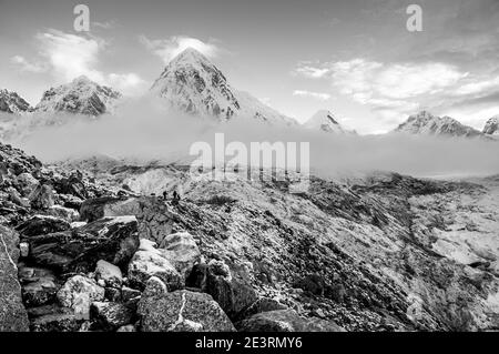 Nepal. Himalayan mountains in monochrome in the Sagarmatha National Park of the Solu Khumbu valley of Mount Everest in Nepal, With Pumori seen here during a passing storm from above Gorak Shep and Everest mountaineering base camp. Stock Photo