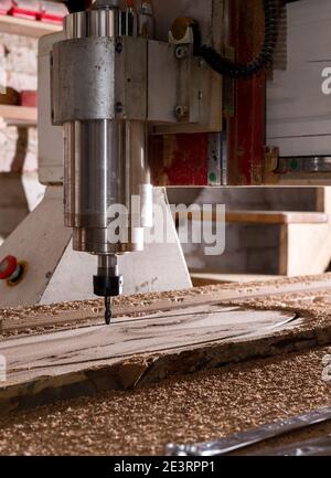 Woodwork cnc machine working on wood board. Tool at the wood factory. Stock Photo