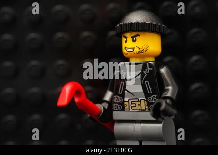 Tambov, Russian Federation - January 13, 2021 Lego robber minifigure with a red crowbar. Stock Photo