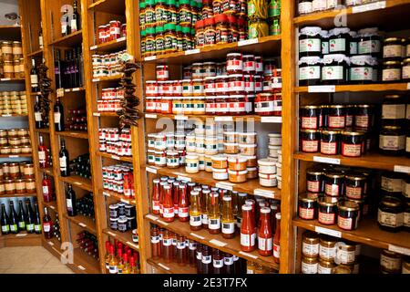 ESPELETTE, FRANCE - AVRIL 19, 2018: Delicatessen shop with assortment of local products, many of them seasoned with famous espelette peppers. Stock Photo