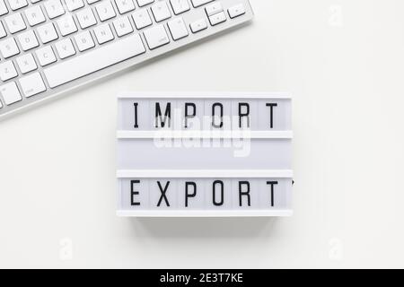 Text IMPORT EXPORT and computer keyboard on white Stock Photo