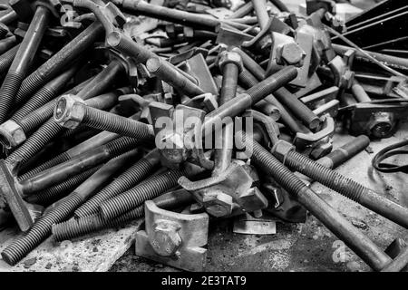 A pile of nuts and long bolts in the workshop of the Oamaru Steam and Rail Restoration Society, Oamaru, New Zealand. Stock Photo