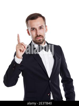 Thumbs up handsome young businessman in business suit. Businessman portrait isolated on white background.The business concept focuses on confidence an Stock Photo