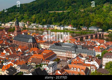 The Heiliggeistkirche (Church of the Holy Spirit) and the Alte Brücke (old bridge) in the Altstadt (old town) of Heidelberg, Baden-Württemberg, German Stock Photo