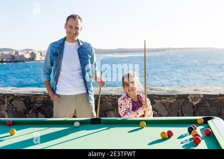 pool table near the sea, family plays billiards Stock Photo - Alamy
