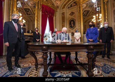 Washington, United States. 20th Jan, 2021. US President Joe Biden signs three documents including an Inauguration declaration, cabinet nominations and sub-cabinet noinations in the Presidents Room at the US Capitol as US Vice President Kamala Harris watches after the inauguration ceremony to making Biden the 46th President of the United States in Washington, DC on January 20, 2021. Pool Photo by Jim Lo Scalzo/UPI Credit: UPI/Alamy Live News Stock Photo