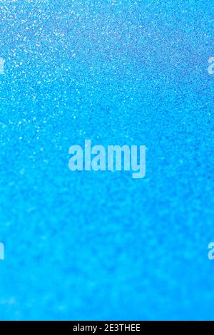 Abstract blue glitter lights background. Circle blurred bokeh. Festive backdrop for Christmas, holiday or event. Winter Card or invitation Stock Photo