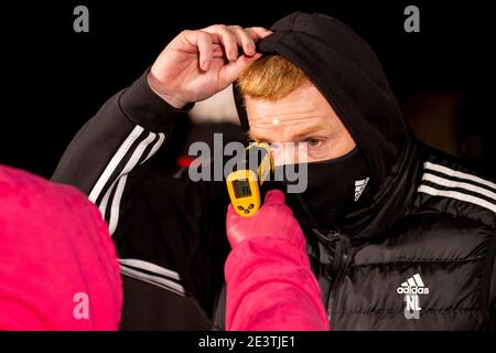 Livingston, West Lothian, UK. 20th January 2021; Tony Macaroni Arena, Livingston, West Lothian, Scotland; Scottish Premiership Football, Livingston versus Celtic; Neil Lennon Celtic Manager has temperature taken on arrival at the stadium Credit: Action Plus Sports Images/Alamy Live News Stock Photo