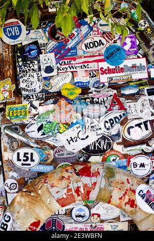 Solid frame of a collection of stickers and bumper stickers in Key West, FL, USA. Famous destination location. Stock Photo