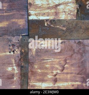 Old aged weathered rusty corroded coat iron sheets texture pattern, multiple horizontal rusted corroding grunge metal patch plates, rustic patched Stock Photo