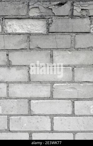 White light grey old aged weathered fine brick wall texture, grungy damaged calcium silicate bricks pattern detail background macro closeup, large Stock Photo