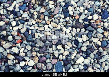 Rocky background with round stones in grey colours Stock Photo