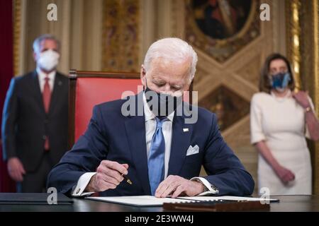 Washington, United States. 20th Jan, 2021. US President Joe Biden signs three documents including an Inauguration declaration, cabinet nominations and sub-cabinet noinations in the Presidents Room at the US Capitol after the inauguration ceremony to making Biden the 46th President of the United States in Washington, DC on January 20, 2021. Pool Photo by Jim Lo Scalzo/UPI Credit: UPI/Alamy Live News Stock Photo