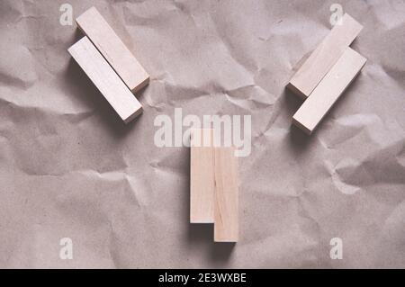 background of crumpled craft paper with wooden rectangles arranged in a certain order in a minimalist style Stock Photo