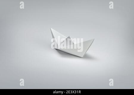 White Paper boat on white background. Stock Photo
