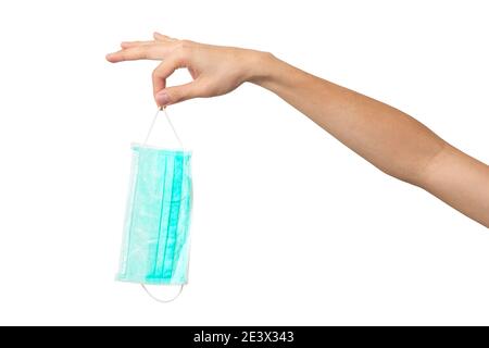 People hand throwing medical face mask isolated on white background. Stock Photo