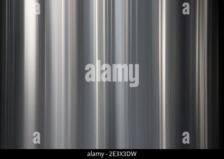 Abstract silver background with vertical blurred lines Stock Photo
