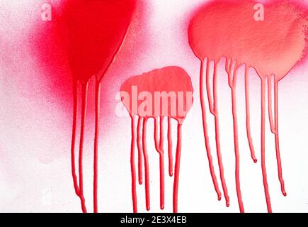 Red spray paint with dripping paint drops isolated on white background Stock Photo