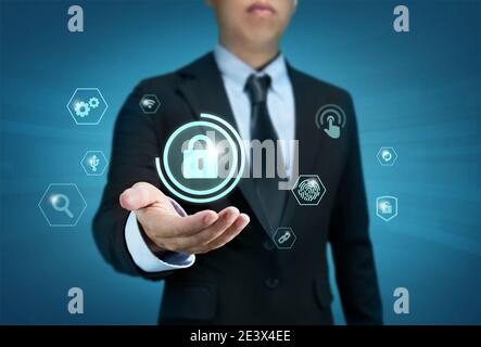 Protection network security computer and safe your data concept, Businessman holding shield protect icon Stock Photo