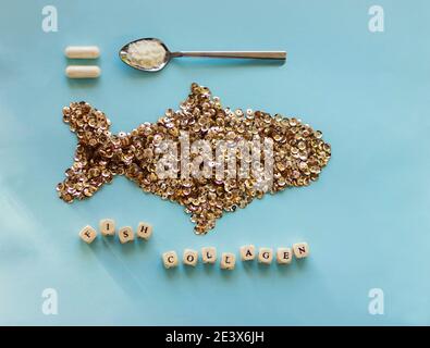 Fish collagen concept. Collagen powder and capsules on trendy background. copyspace for text. Beauty and spa concept. Stock Photo