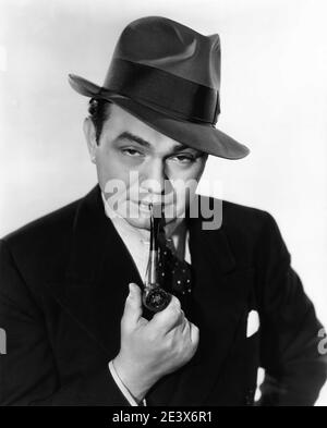 EDWARD G. ROBINSON circa 1936 Portrait with Pipe and Hat by BERT LONGWORTH  publicity for Warner Bros Stock Photo