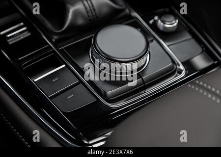Close up shot of modern central console with  buttons  on car panel, no trade marks Stock Photo