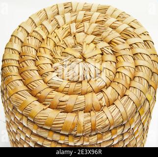 Handmade natural product, round wicker basket, rattan weaving. Eco friendly and sustainable concept. Eco-friendly shopping and recycled gifts. Stock Photo