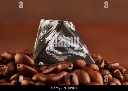Chocolates in the form of precious stones on coffee beans. Gift for St. Valentine Stock Photo