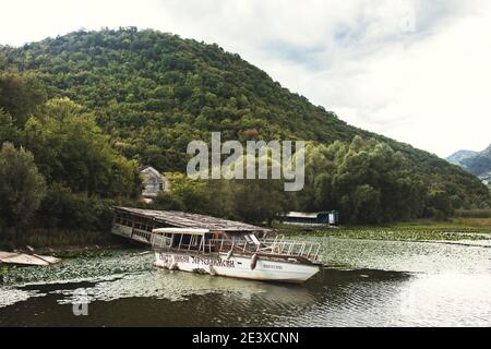 Virpazar, Montenegro - August 19, 2020: Pleasure motor boats along the coast - water transport parking - boating Stock Photo