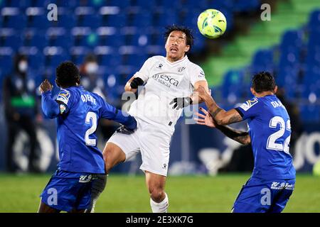 Damian Suarez of Getafe FC and Shinji Okazaki of SD Huesca during La Liga match between Getafe CF and SD Huesca at Coliseum Alfonso Perez in Getafe, Spain. January 20, 2021. (Photo by Perez Meca/MB Media) Stock Photo