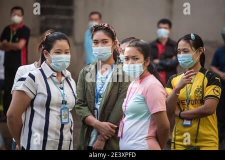 Bangkok, Thailand. 01st Jan, 2000. Migrant workers waiting for saliva-based Covid-19 test at Bangkok Fish Marketing Organization during a Covid-19 screening and testing following a new outbreak in Thailand.Thailand Health Ministry recorded a total of 12,795 infections, 71 death and 9,842 recovered since the beginning of the outbreak. Credit: SOPA Images Limited/Alamy Live News Stock Photo