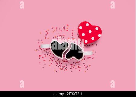Happy valentine. Cups of coffee with gift box heart shape with confetti over pink background Stock Photo