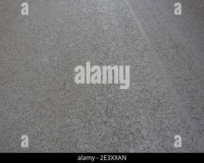 Dark gray new asphalt pavement. Full screen photo. Stock Photo