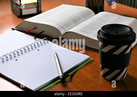person writing on a notebook Stock Photo
