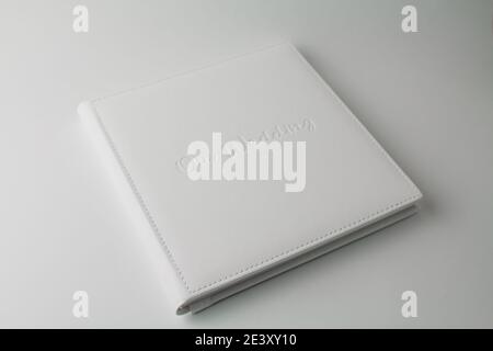 a white wedding photo book from white leather on white background Stock Photo