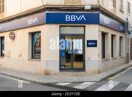 Campos, Spain; january 20 2021: main facade of the BBVA bank office (Banco Bilbao Vizcaya) on a sunny morning in the Majorcan town of Campos Stock Photo