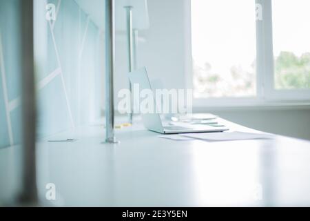 background image of a laptop and business documents on the office Desk. Stock Photo