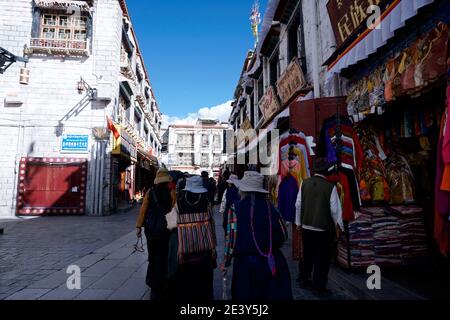 Pilgrims and tourists walking on Barkhor Street. Stock Photo