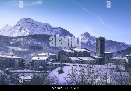 Piazza al Serchio snowy village and Apuan Alps mountains in winter. Garfagnana, Tuscany, Italy, Europe Stock Photo