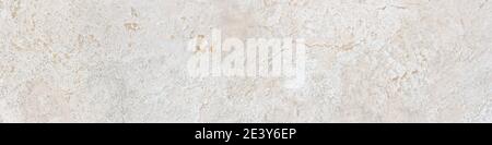 Beige limestone similar to marble surface or texture background in banner format. High resolution photography Stock Photo