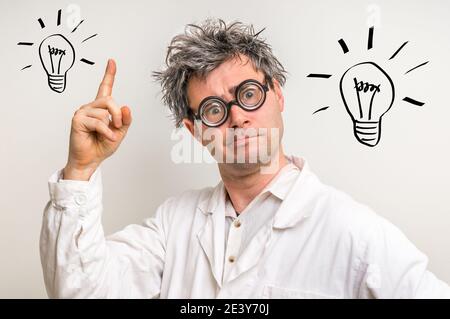 Crazy scientist got the great idea in laboratory with bulb symbol Stock Photo